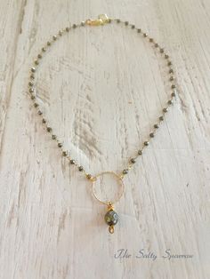 Shimmering “fool’s gold” pyrite stones with a gold filled circle and a pyrite dangle is a simple but stunning statement look. Sixteen inches with a gold filled lobster clasp. Fool’s Gold, Circle Necklace, Lobster Clasp, Gold Filled, Stone, Gold