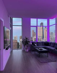 a living room filled with furniture and large windows covered in purple lighting next to a cityscape