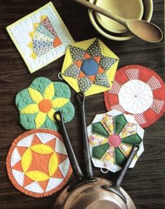 several different types of quilts and scissors on a table