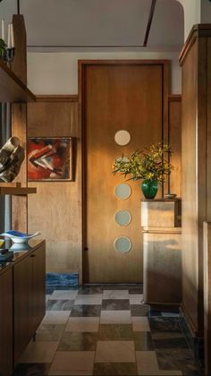 an entry way with a potted plant on the counter