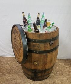 a wooden barrel filled with bottles of beer