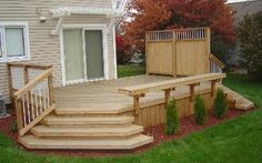 a wooden deck with steps leading up to it