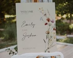 a welcome sign with flowers on it