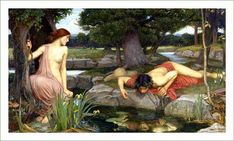 two women are laying on the rocks near a pond and one is bending over to look at another woman