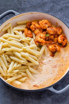 pasta with shrimp and sauce in a pan