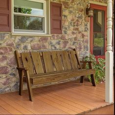 a wooden bench sitting on top of a hard wood porch