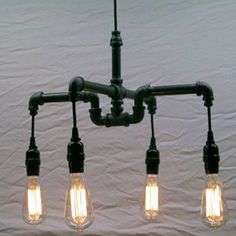 five light bulbs are hanging from the ceiling in an industrial - style chandelier