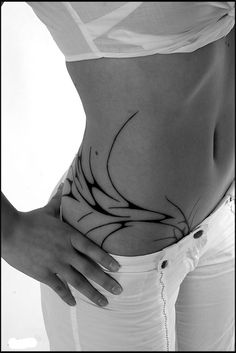 a woman's stomach with an intricate design on it