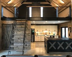 an open floor plan with stairs leading up to the loft