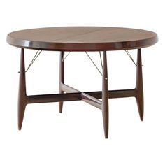 an oval wooden table with two legs and a circular top, on a white background