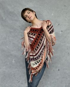 Crochet poncho in browns, Alpaca poncho wrap, Boho poncho in earth tones, Crochet cover-up. This crochet alpaca fringe poncho in earth tones is very soft and gentle. Poncho is lightweight and it's made of soft yarn - a blend of alpaca and silk, that's why it is very fluffy and soft to the touch. It will be the perfect accessory for spring and fall or even cool summer nights.  Size M/L Color: ecru and various shades of browns. Because of different monitors and screen resolutions, color may look different on the screen than in reality. If you want such poncho in any other color and size please feel free to contact me. I will be happy to make it for you. Care instructions: Hand washes in lukewarm water (30o C). Dry flat. Fall Festival Cape Poncho, Fall Festival Poncho Shawl, Fall Festival Shawl Poncho, Cozy Brown Shawl For Fall, Bohemian Shawl Poncho For Fall, Beige Bohemian Shawl Poncho, Bohemian Beige Poncho For Fall, Hippie Poncho For Fall, One Size Brown Fringe Poncho