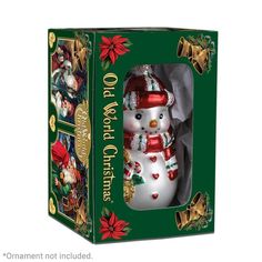 a boxed christmas ornament with a snowman in the center and other ornaments around it