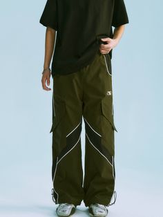 The Redux Cargo Pants feature a woven fabric body in a loose straight-leg fit. Paneled construction with contrast trim detailing. Embroidered logo to the front alongside slanted cargo pockets at each leg. Logo hardware adjustable drawcord waist and hem. Welt pockets to the sides with a single pocket to the back. Finished off with signature GRKC garment labels. Cargo Pockets Logo Hardware Elasticated Waist Straight Leg Fit No Restocks 100% Polyester Unisex Model Bo is 184cm / 6'0" tall and wearin Unisex Cargo Pants, Jeans Cargo, Utility Pants, Mens Cargo, Garment Labels, Athletic Pants, Lake District, Contrast Trim, Welt Pockets