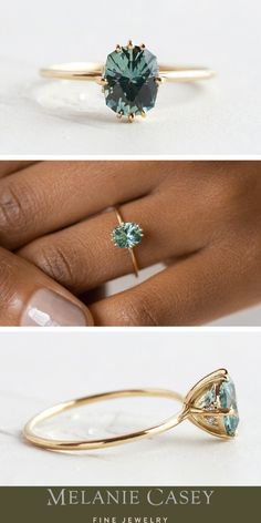 a woman's hand holding an engagement ring with a green stone in it and the words melanie casey fine jewelry