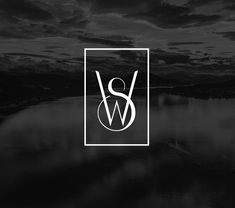 black and white logo with the letter w in it's center, on a dark background