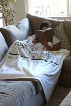 Cozy Up With Your Favorite Book and a Plush Reading Blanket: This soft and warm reading blanket is perfect for book lovers who like to snuggle up with a good read. The plush material makes it extra comfortable and the design features a fun book-themed print. Give this as a gift or treat yourself to a cozy reading experience. Do you feel that your home is missing an eye-catching, yet practical design element? Solve this problem with a soft plush throw blanket that's ideal for lounging on the couch during chilly evenings. * 100% polyester * Blanket size: 50″ × 60″ (127 × 153 cm) * Soft silk touch fabric * Printing on one side * White reverse side * Machine-washable * Hypoallergenic * Flame retardant Reading Blankets, Couch With Blanket, Enchanted Library, Reading Blanket, Fuzzy Throw Blanket, Cute Spiral Notebooks, Plush Throw Blanket, Cute Journals, Golden Birthday