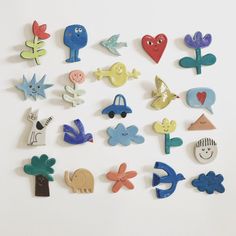 a bunch of different shaped magnets on a white surface