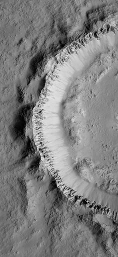 an aerial view of the earth's surface in black and white, with snow on it