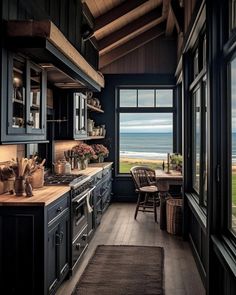 a kitchen with an ocean view is shown from the inside, and has dark wood cabinets