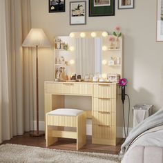 a bedroom scene with focus on the dressing table and vanity mirror, which is illuminated by lights