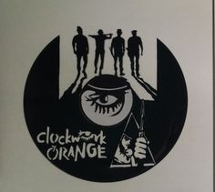 the clockwork orange logo is shown in black and white, with three silhouettes on it