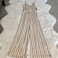 Express Jumpsuit Wide Leg Beige With Black Stripe Thin Strap Sweetheart Neck Line Brand New With Tags Blush Pink Jumpsuit, Express Jumpsuit, Sweetheart Neck Line, Black Strapless Jumpsuit, Black Sleeveless Jumpsuit, Jumpsuit Wide Leg, Flower Romper, One Piece Jumper, Denim Overalls Shorts