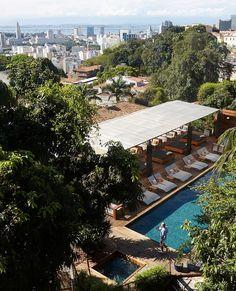 an aerial view of a swimming pool and cityscape