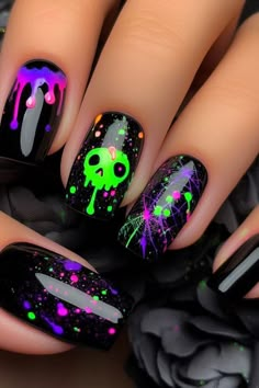 Add a vibrant touch to your Halloween look with these black nails featuring neon green and purple accents. This eye-catching design combines classic black polish with bold neon highlights for a fun and festive manicure. Perfect for celebrating the season with a pop of color with minimal effort. Glowing Halloween Nails, Gel Polish Halloween Nails, Vibrant Halloween Nails, Black Bright Nails, Purple Black And Green Nails, Black And Neon Halloween Nails, Monster Truck Nail Designs, Halloween Nail Designs Glow In The Dark, Halloween Nails Witch Theme