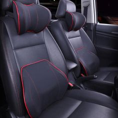 the interior of a car with black leather and red stitching on the front seats