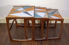 three wooden tables sitting on top of a hard wood floor