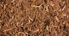 close up view of brown wood chips on the ground