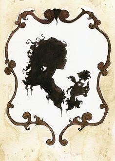 the silhouette of a woman's head in an ornate frame