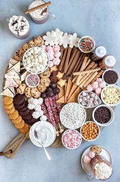 a platter filled with lots of different kinds of snacks and desserts on top of each other