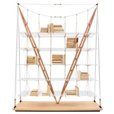 a display case with books and other items in it on a wooden base, against a white background