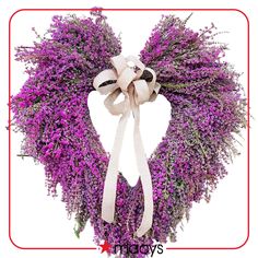 a heart shaped wreath with lavenders tied around it