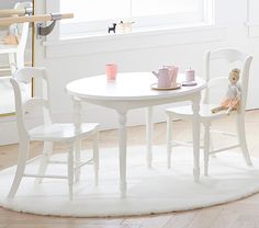 a white table and chairs in a room