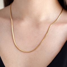 High quality snake necklace chain for everyday use. This minimalist design is hand-crafted with love and passion. *Free Express International Shipping NEXT BUSINESS DAY SHIPPING! PRODUCT DETAILS *The product is made of 100% 14k Solid Gold and it has a 14K or 585 stamp on item. (We don't sell filled or plated jewelry) *The package includes a gold certificate. *Every package comes in a gift box. *14K gold indicates that the product is produced from 58% pure gold. *Chain thickness: 2,15 mm /0,085 i Talibotu Chain Designs, Daily Wear Chains, Plain Gold Chain, Gold Chain For Girls Simple, Gold Simple Chain, Minimalist Snake Shape Chain Necklace For Gift, Daily Wear Gold Chains For Women Indian, Minimalist Snake Chain Necklace With Adjustable Chain, Minimalist Herringbone Chain Necklace Gift