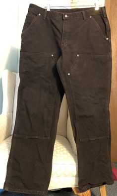 Women’s Carhartt Brown Work Wear Double Knee Pants Size: 18 x 32 Color: Dark Brown Design: Thick, Double Knee work pants Deep pockets Materials: 100% Cotton Measurements (approximate): Waist (laying flat): 19 inches Rise: 11 inches Inseam: 32 inches Leg Opening (laying flat): 10 inches Condition: very good condition. No rips or holes. Some small fade spots. Virtually no wear to bottom hems - see photos. Shipped with USPS Priority Mail. Cartthart Pants, Brown Double Knee Pants Outfit, Carhartt Double Knee Pants Outfit, Carhartt Brown Pants, Knee Pants Outfit, Double Knee Carhartt, Hellboy Tattoo, Carhartt Double Knee Pants, Carhartt Work Pants