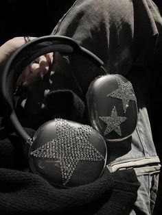 a person holding a steering wheel and some other items