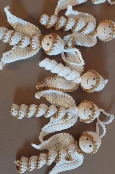 crocheted nativity figurines are arranged on the floor in front of a wall