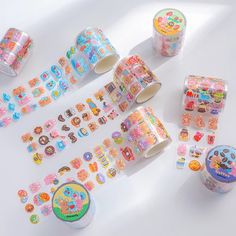 several rolls of washi tapes and stickers on a white surface with the same pattern