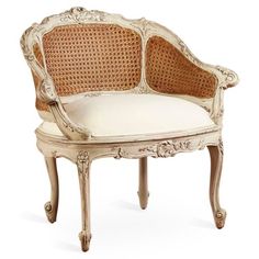 an antique chair with wicker back and white cushion on the seat is shown in front of a white background