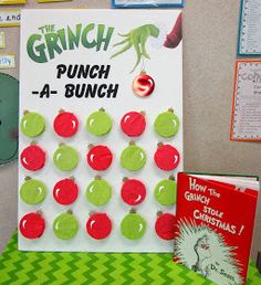 the grinch punch - a - bunch game is displayed in front of a bulletin board