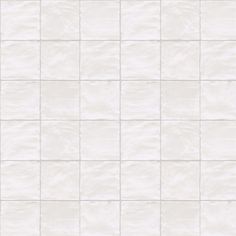 a white tile wall with small squares on it