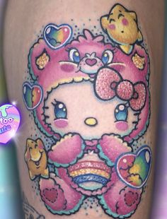 an image of a hello kitty tattoo on the thigh