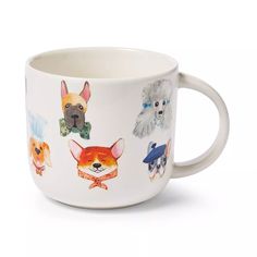 a white coffee cup with dogs on it