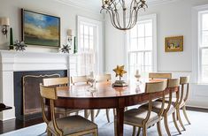 a dining room table with chairs and a chandelier