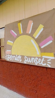 a sign on the side of a building that says senior sunset