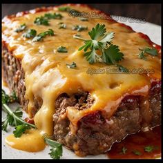 a piece of meatloaf covered in cheese and garnished with parsley