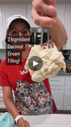 a woman is making some kind of cream filled cake in her kitchen with the words, 2 ingredient coconut cream filling